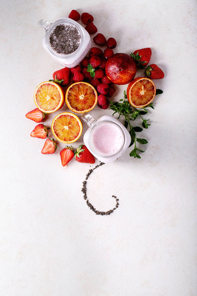 Strawberry smoothie in glass jars - Fotó, kép