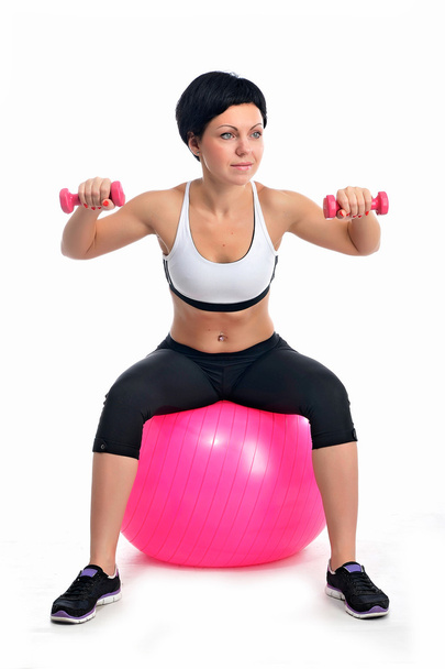 Fiatal nő, egy fitness labda - Fotó, kép