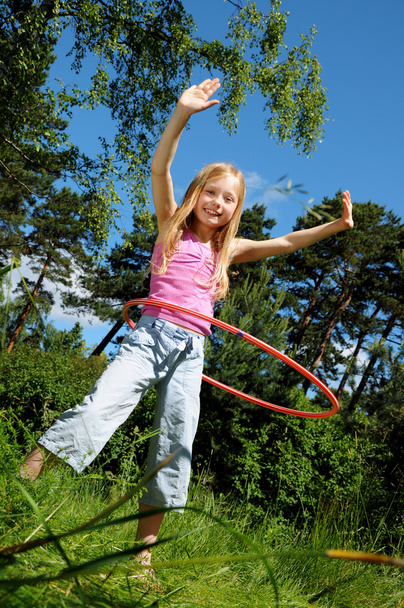 Little girl with hula hoop - Photo, image