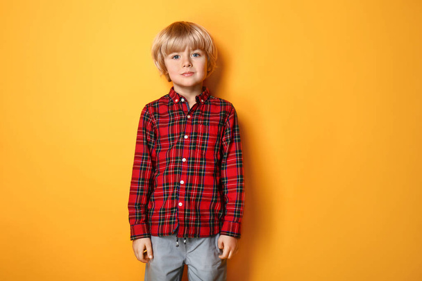 Cute little boy on color background - Photo, Image