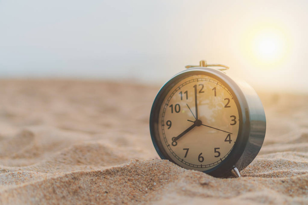 Selective focus of alarm clock with nature background. - Foto, imagen