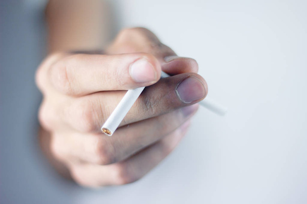 Quitting smoking - male hand crushing cigarette - Фото, зображення