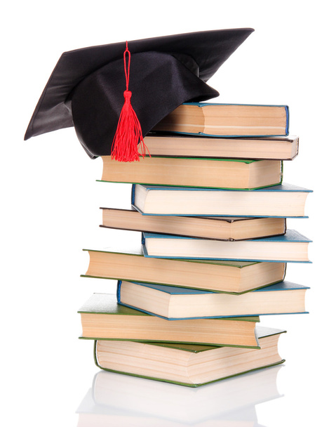 Grad hat with books isolated on white - Φωτογραφία, εικόνα