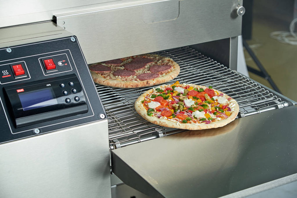 Industrial electric pizza oven for catering. Professional kitchen equipment - Photo, Image