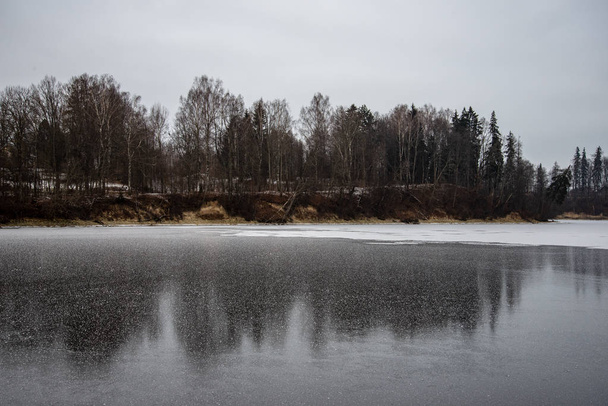 almost frozen river in winter - Fotó, kép