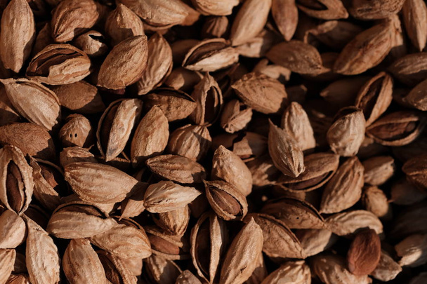 Almonds background. Almonds texture. Healthy organic food concept. Top view - Fotoğraf, Görsel
