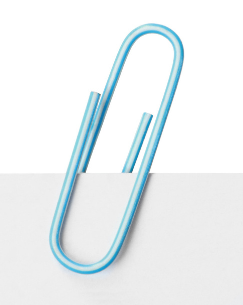 Close up of a light blue paper clip - Photo, image