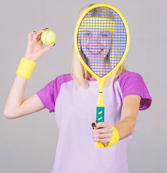 Tennis sport and entertainment. Active leisure and hobby. Girl fit slim blonde play tennis. Sport for maintaining health. Active lifestyle. Woman hold tennis racket in hand. Tennis club concept - Foto, afbeelding