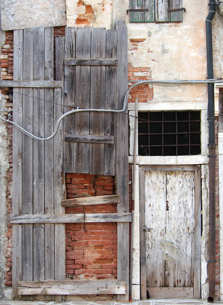 abandoned board up derelict house with padlocked door and decayi - Photo, Image