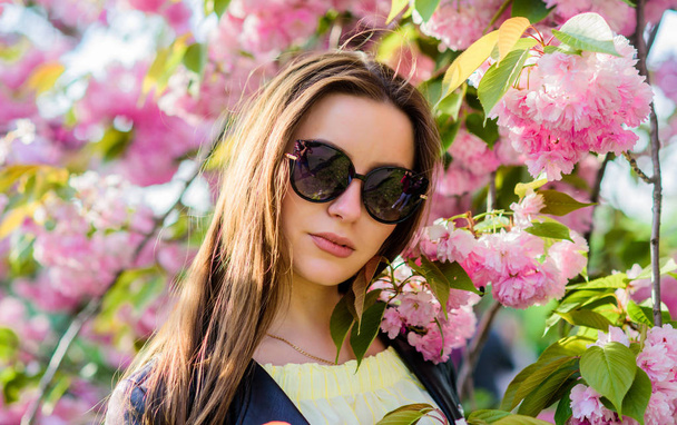 natural summer beauty. girl in cherry flower. Sakura tree blooming. woman in spring flower bloom. skincare and spa. Natural cosmetics for skin. blossom smell, allergy. Spring collection - Foto, afbeelding