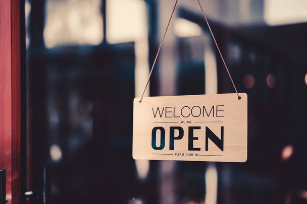 Open sign hanging front of cafe with colorful bokeh light abstract background. - Photo, Image