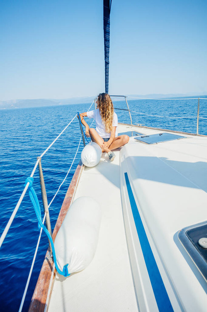 Beautiful Girl relaxing On Yacht in Greece - Foto, imagen