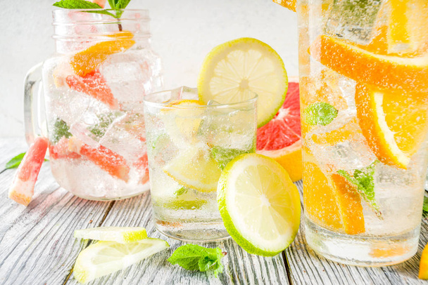 Four types of citrus lemonade or mojito  - Фото, изображение