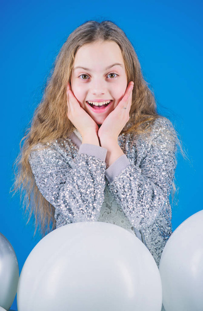 Celebrating the happiness. Happy little girl. Adorable small child happy smiling with birthday balloons. Cute kid with happy smile on her lovely face. Happy childhood is one of the best gifts - Фото, изображение