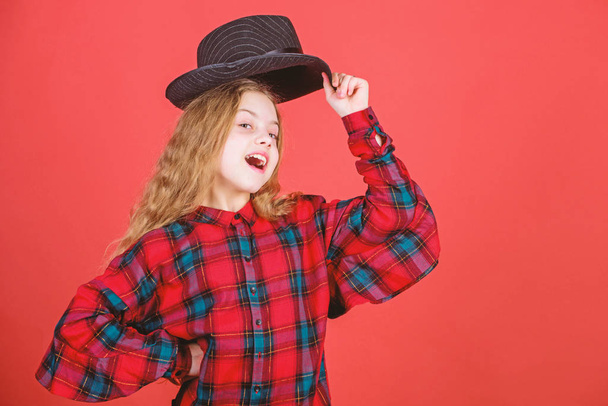 Acting school for children. Acting lessons guide children through wide variety of genres. Develop talent into career. Girl artistic kid practicing acting skills with black hat. Enter acting academy - 写真・画像