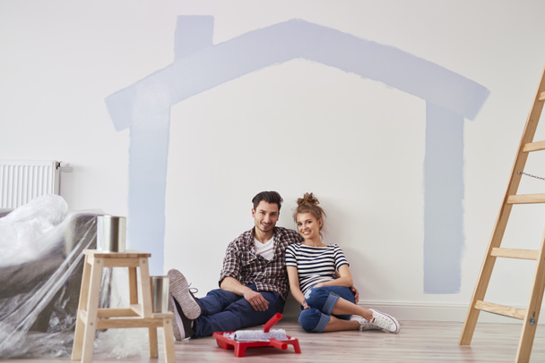 Portrait of couple in their new home - Photo, Image