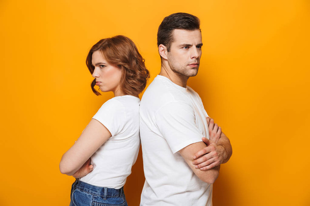 Angry beautiful couple wearing white t-shirts - Fotoğraf, Görsel