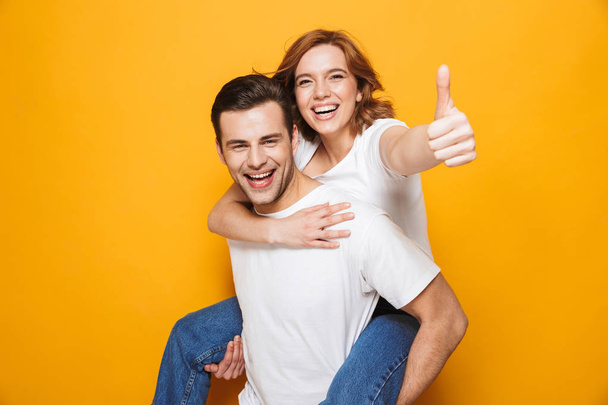Portrait of a cheerful young couple standing - Photo, image