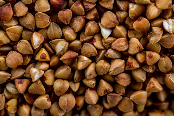 Dry buckwheat texture close up.  - Fotó, kép