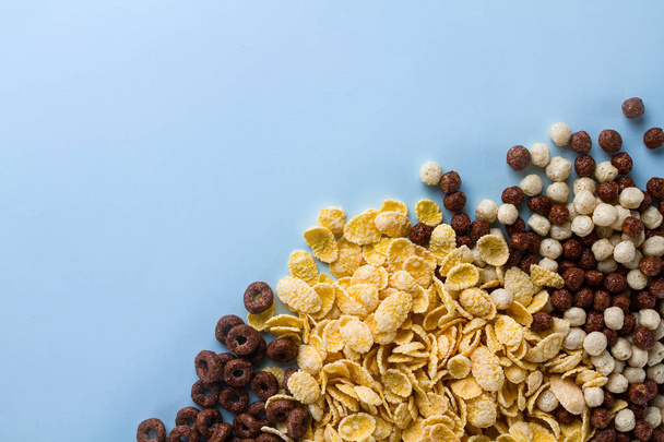 Mix of dry, chocolate balls, rings and yellow corn flakes for ce - Φωτογραφία, εικόνα