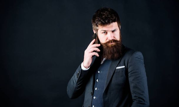 Concentrated on work. brutal caucasian hipster with moustache. Male formal fashion. businessman in suit. business communication. Mature hipster with beard speak on phone. Bearded man with smartphone - Zdjęcie, obraz