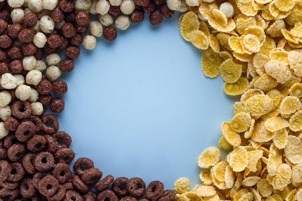 Mix of dry, chocolate balls, rings and yellow corn flakes for he - Fotografie, Obrázek