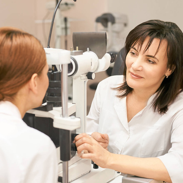 Eye ophthalmologist exam. Eyesight recovery. Astigmatism check concept. Ophthalmology diagmostic device. Beauty girl portrait in clinic - Fotografie, Obrázek