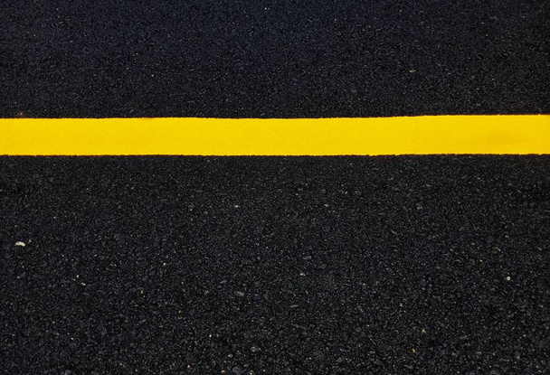 Road traffic paint Yellow on the asphalt surface - Photo, Image