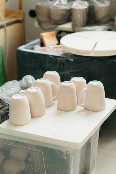 Ceramic mug made on a Potter's wheel in the workshop - Valokuva, kuva