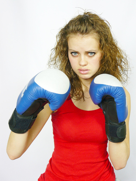 Young nice sportswoman in boxing gloves - Fotografie, Obrázek