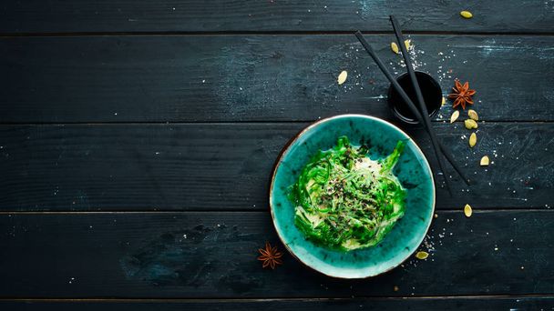 Green salad of seaweed in a plate. Top view. Free space for your text. - Foto, Bild