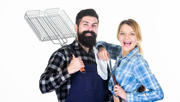Picnic and barbecue. Family getting ready for barbecue. Backyard barbecue party. Cooking together. Essential barbecue dishes. Bearded hipster and girl hold cooking grilling utensils white background - Фото, зображення