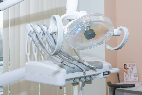 Stomatological instrument in the dentists clinic. Dental background: work in clinic, tooth replacement.dental equipment such as drills in dentists surgery - Photo, Image