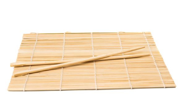 Serie. palillos aislados en estera de bambú
 - Foto, imagen