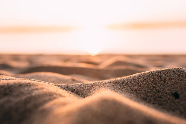 Sunset - dawn on the beach, sand close-up - Foto, Bild