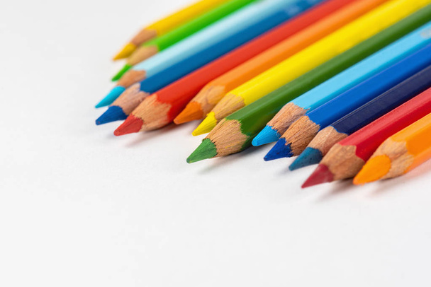 Set of colored pencils. Colors of rainbow. Colored pencils for drawing different colors on a white background. - Foto, imagen