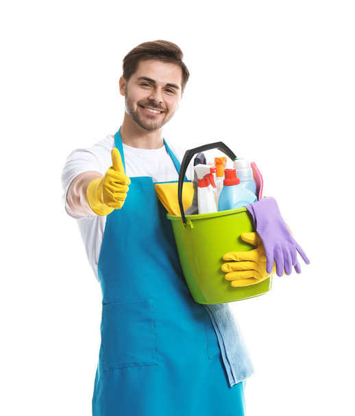 Male janitor with cleaning supplies on white background - Zdjęcie, obraz