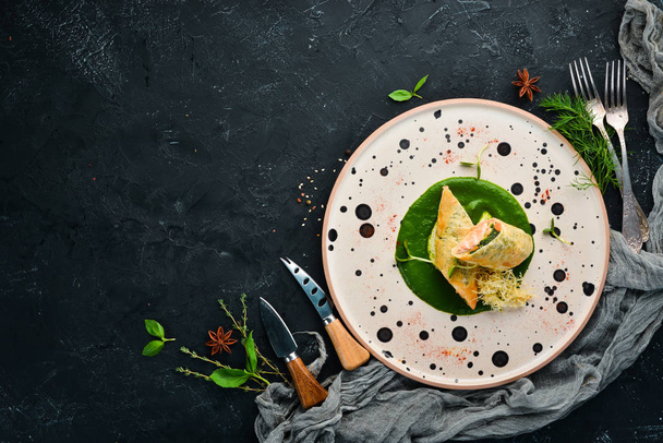 Rolls with salmon and spinach. Lavash. In the plate. Top view. Free space for your text. Rustic style. - Fotografie, Obrázek
