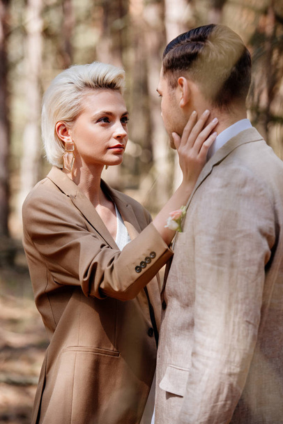 Selective focus of stylish woman touching man face - Valokuva, kuva