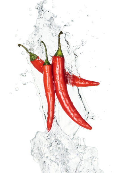spicy chili peppers with clear water splash and drops isolated on white - Photo, Image
