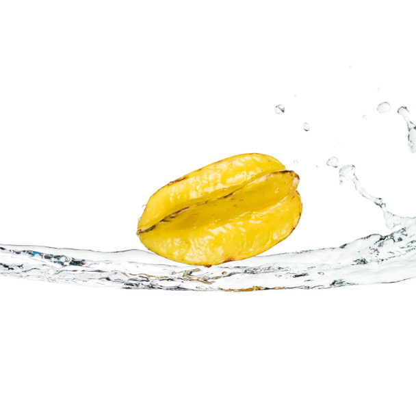 whole ripe exotic star fruit on water stream isolated on white - Fotoğraf, Görsel