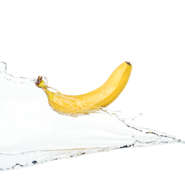 whole ripe yellow banana on water clear stream isolated on white - Photo, Image