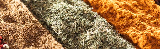 close up view of various aromatic traditional indian spices, panoramic shot - Photo, Image
