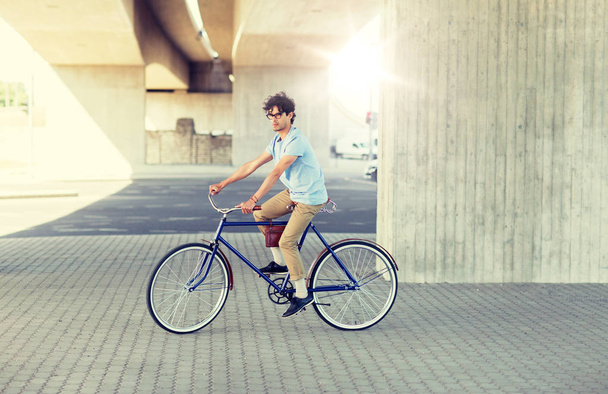 young hipster man riding fixed gear bike - Fotoğraf, Görsel