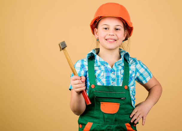 Build your future yourself. Initiative child girl hard hat helmet builder worker. Tools to improve yourself. Child care development. Future profession. Builder engineer architect. Kid builder girl - Foto, afbeelding