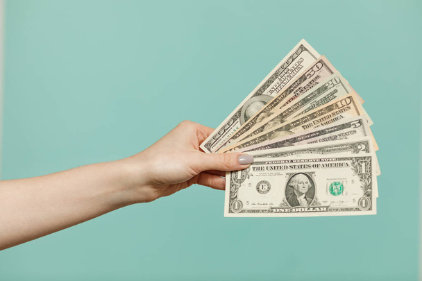 Business and Finances concept. Cash Money.  Woman holding American dollars money banknotes. - Foto, imagen