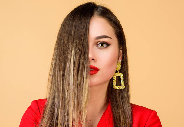 Sexy woman with professional makeup. Fashion portrait of elegant woman. jewelry earrings. Girl in red jacket. beauty and fashion. hair beauty and hairdresser salon. Add some action to your life - 写真・画像