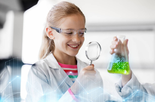 girl studying test tube at school laboratory - Foto, immagini