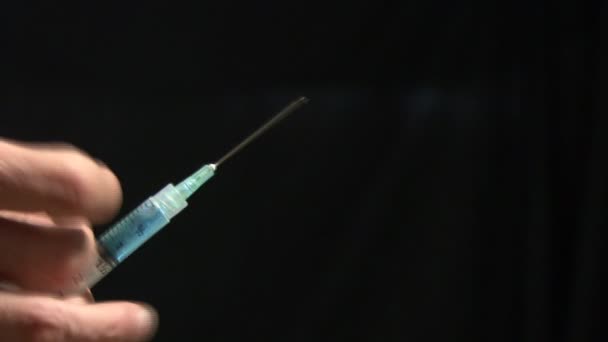 Syringe filled with medication. Healthcare and medicine. Syringe close-up - Filmati, video