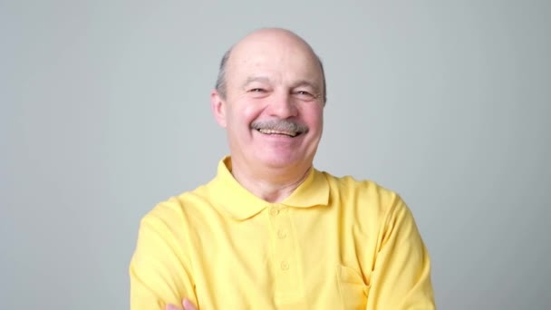 Mature adult man laughing looking at the camera. Positive emotion concept - Footage, Video